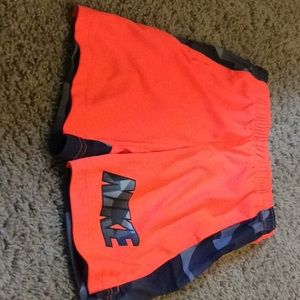 Neon orange Nike shorts